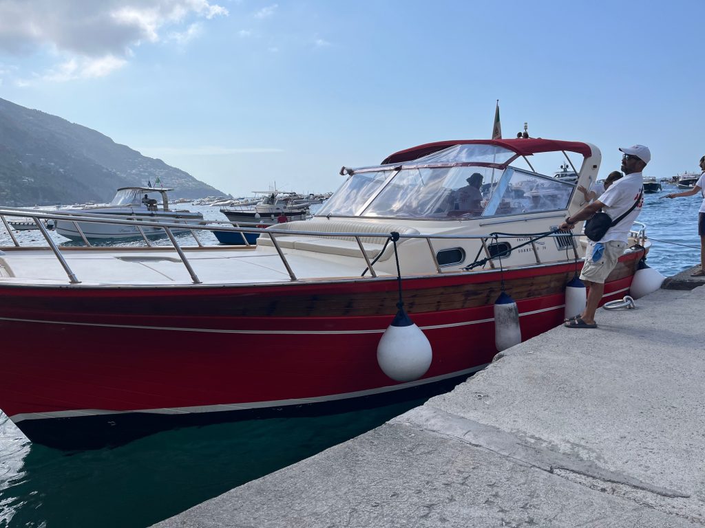 A boat docking at the Positano marina