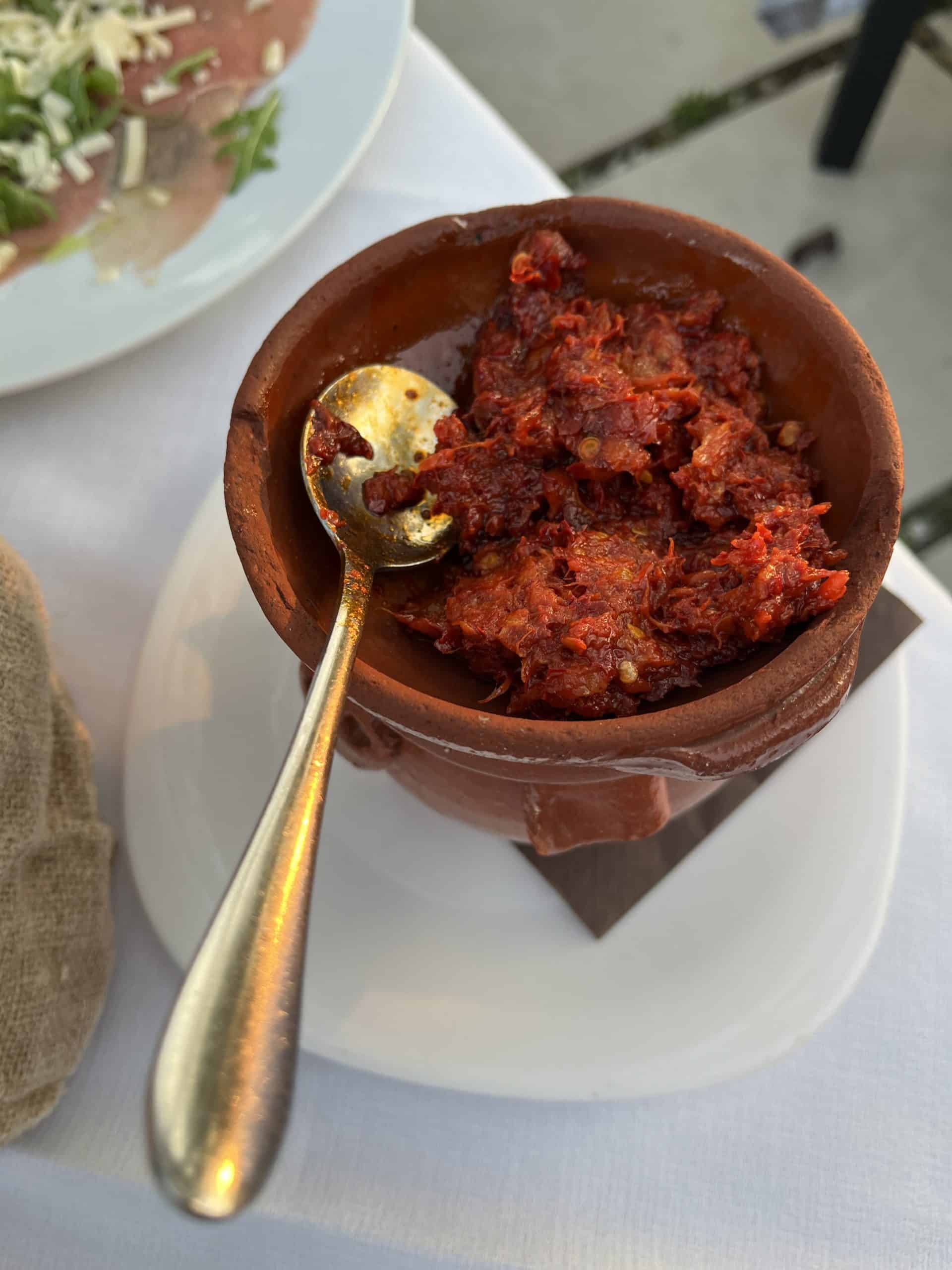 Nduja red tomato spread in a clay pot