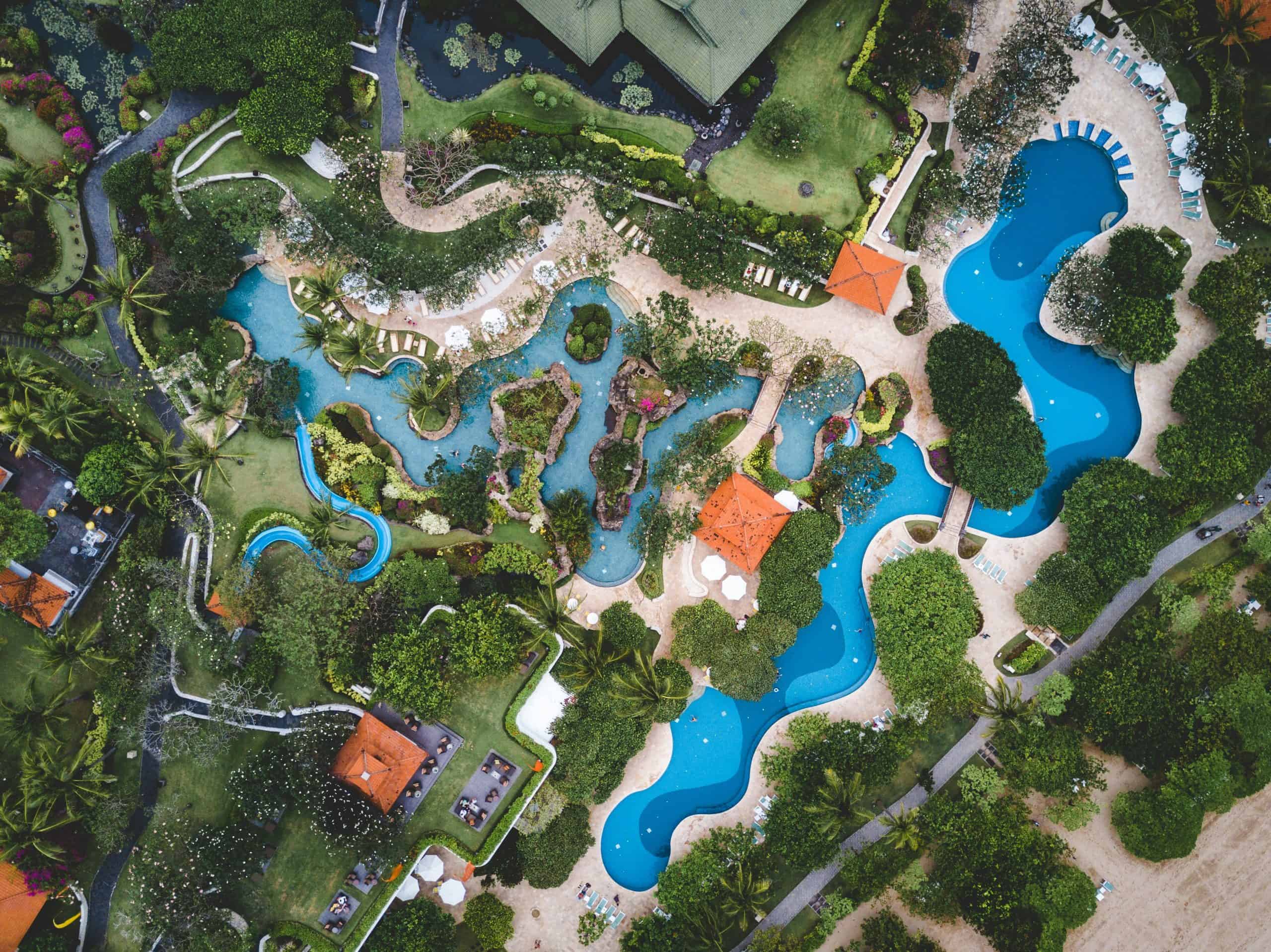 aerial view of resort with swimming pools