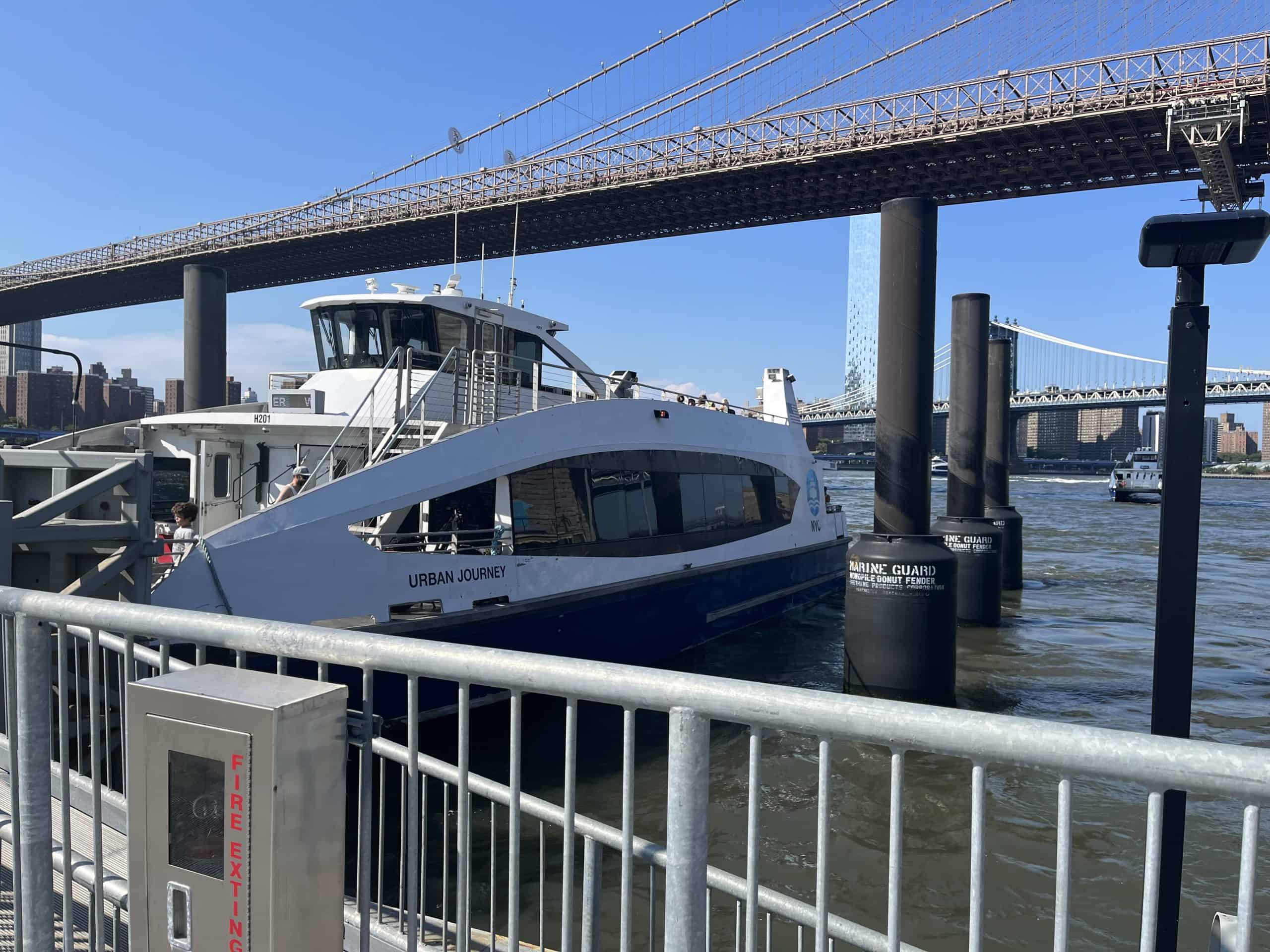 Ferry on water near Brooklyn bridge