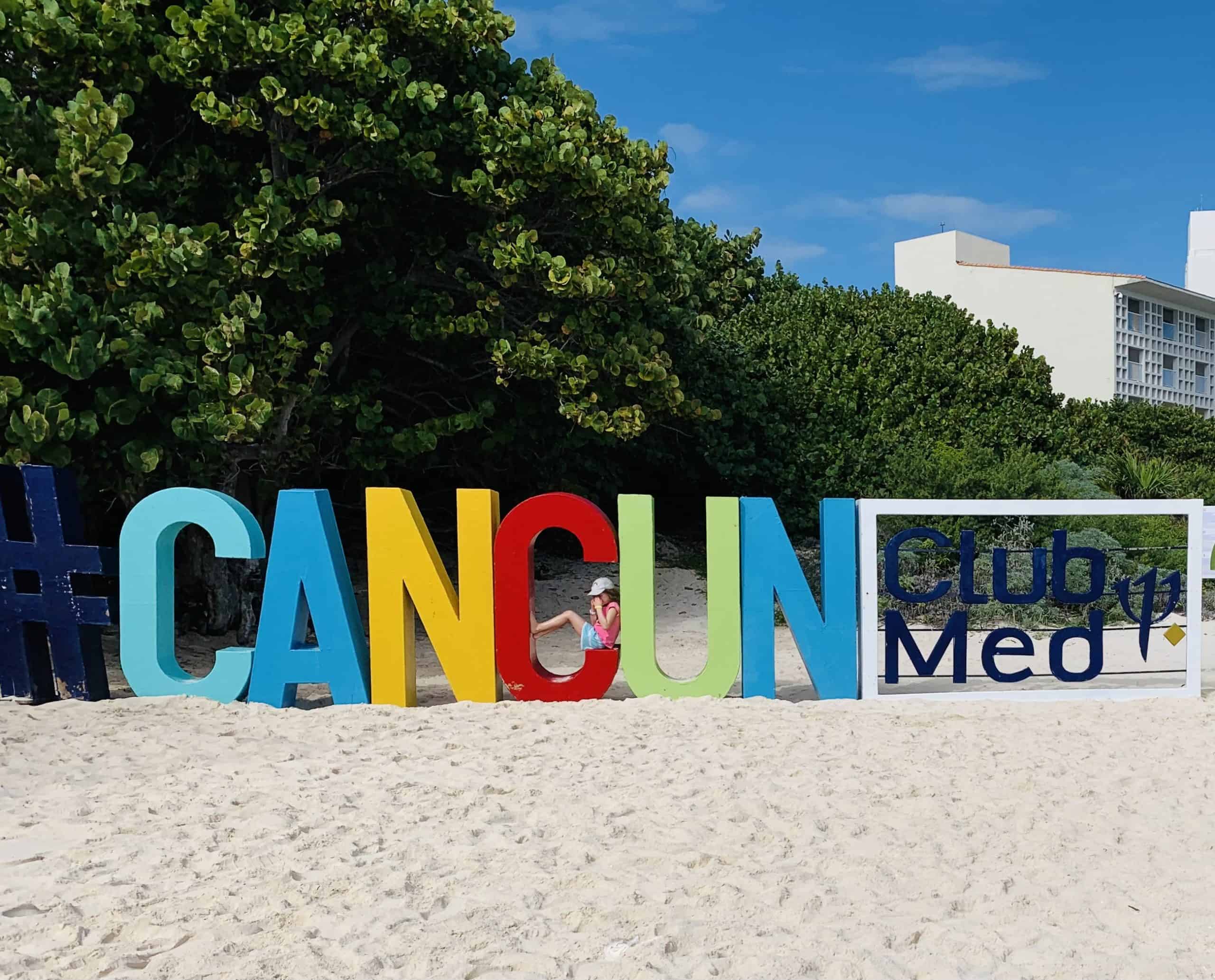 Cancun Club Med sign on the beach
