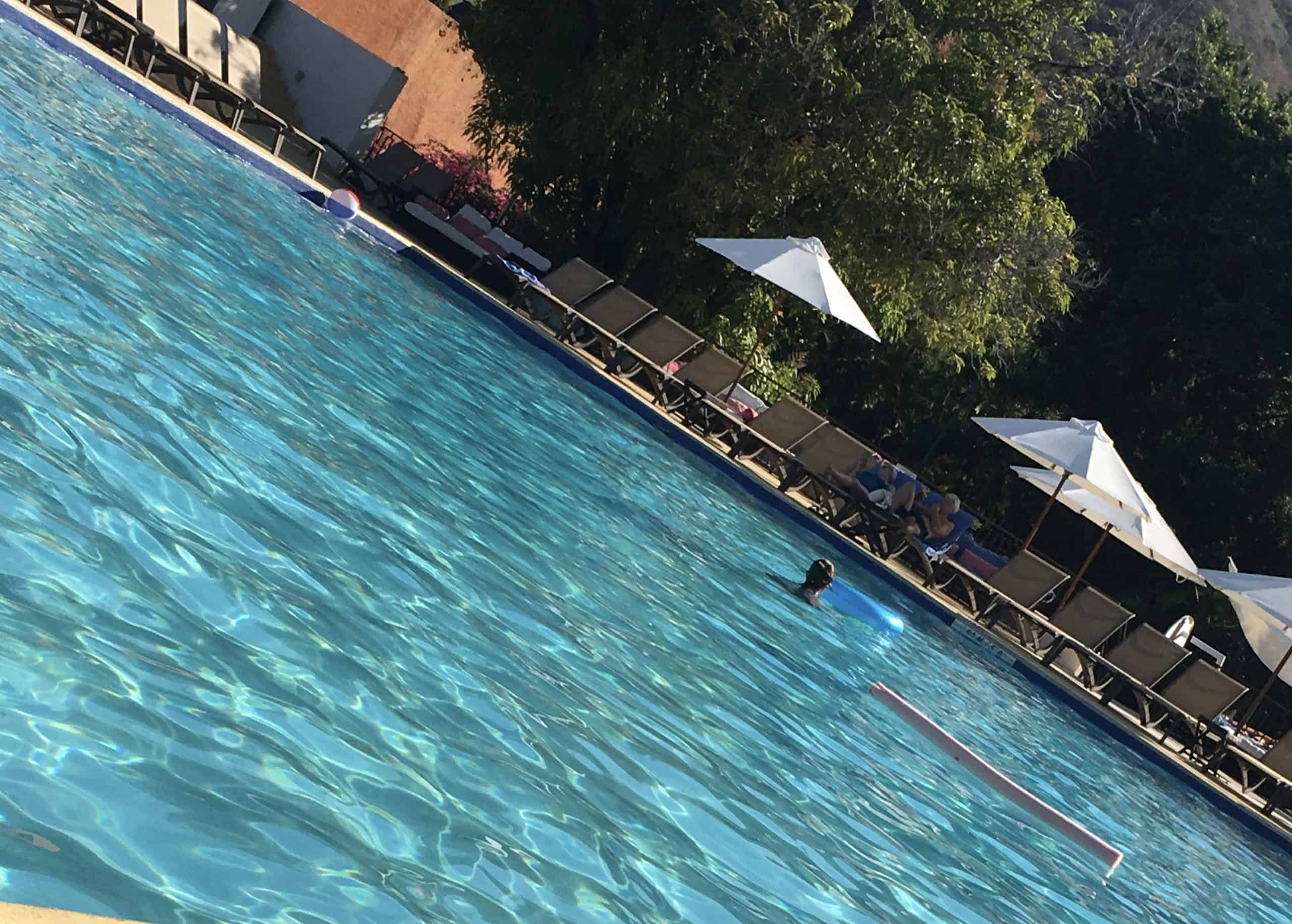 Person swimming in a pool