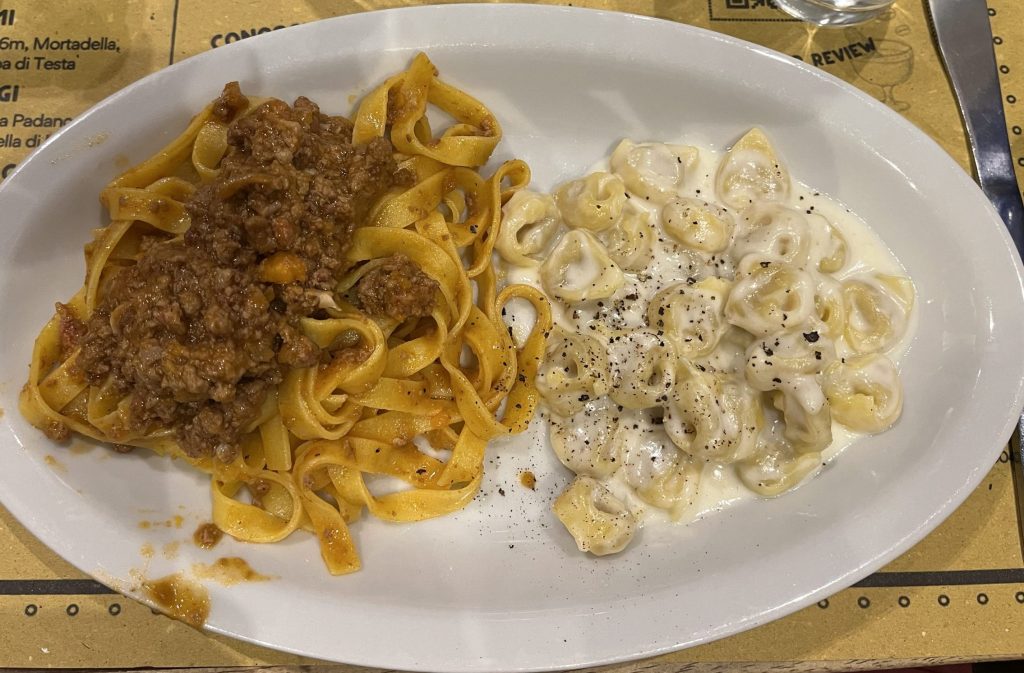 Plate of ragu bolognese and tortellini