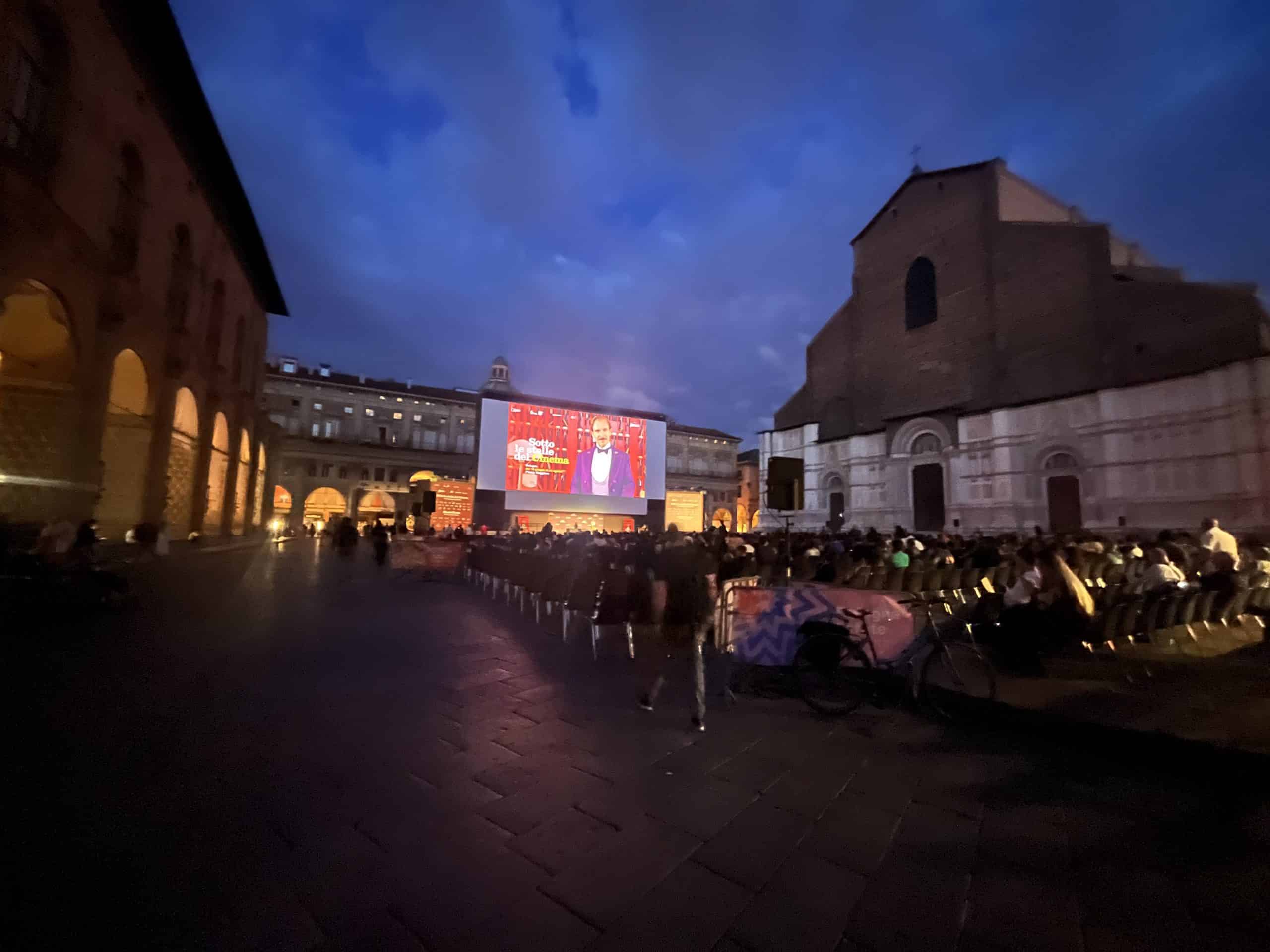 People watching film outside in Bologna