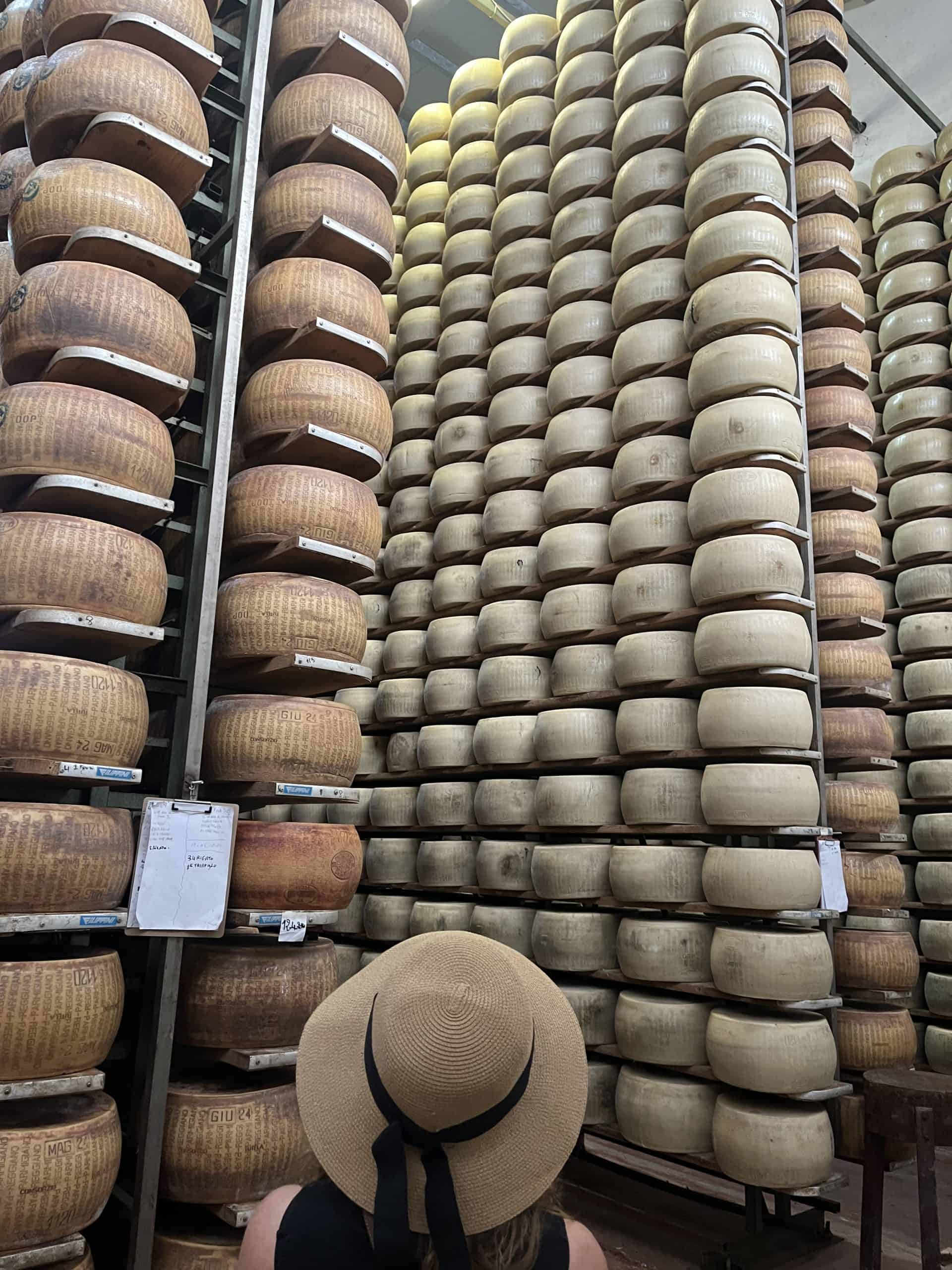Stacks of cheese wheels in a Parma factory