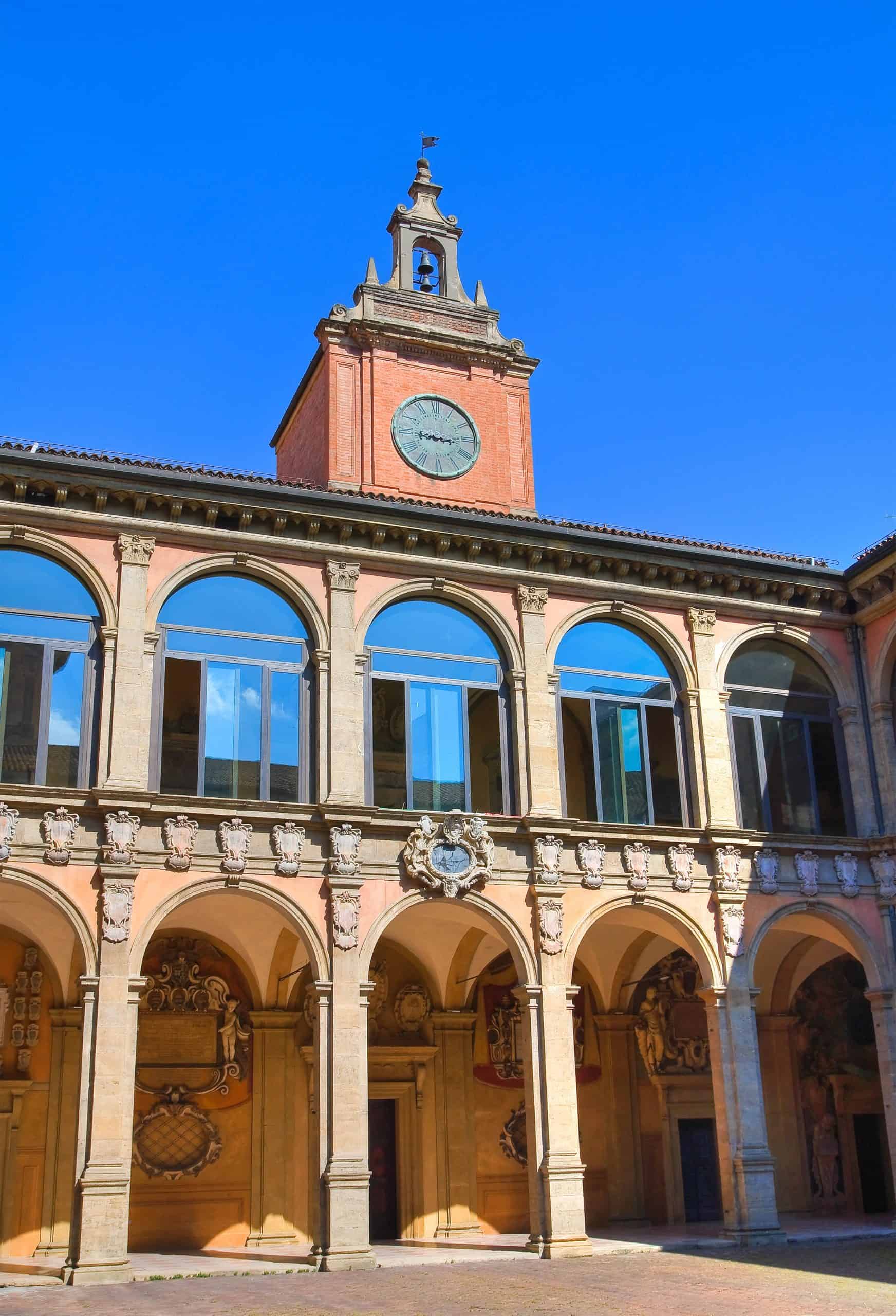 Colorful European Town Hall with Clock Tower against Blue Sky.