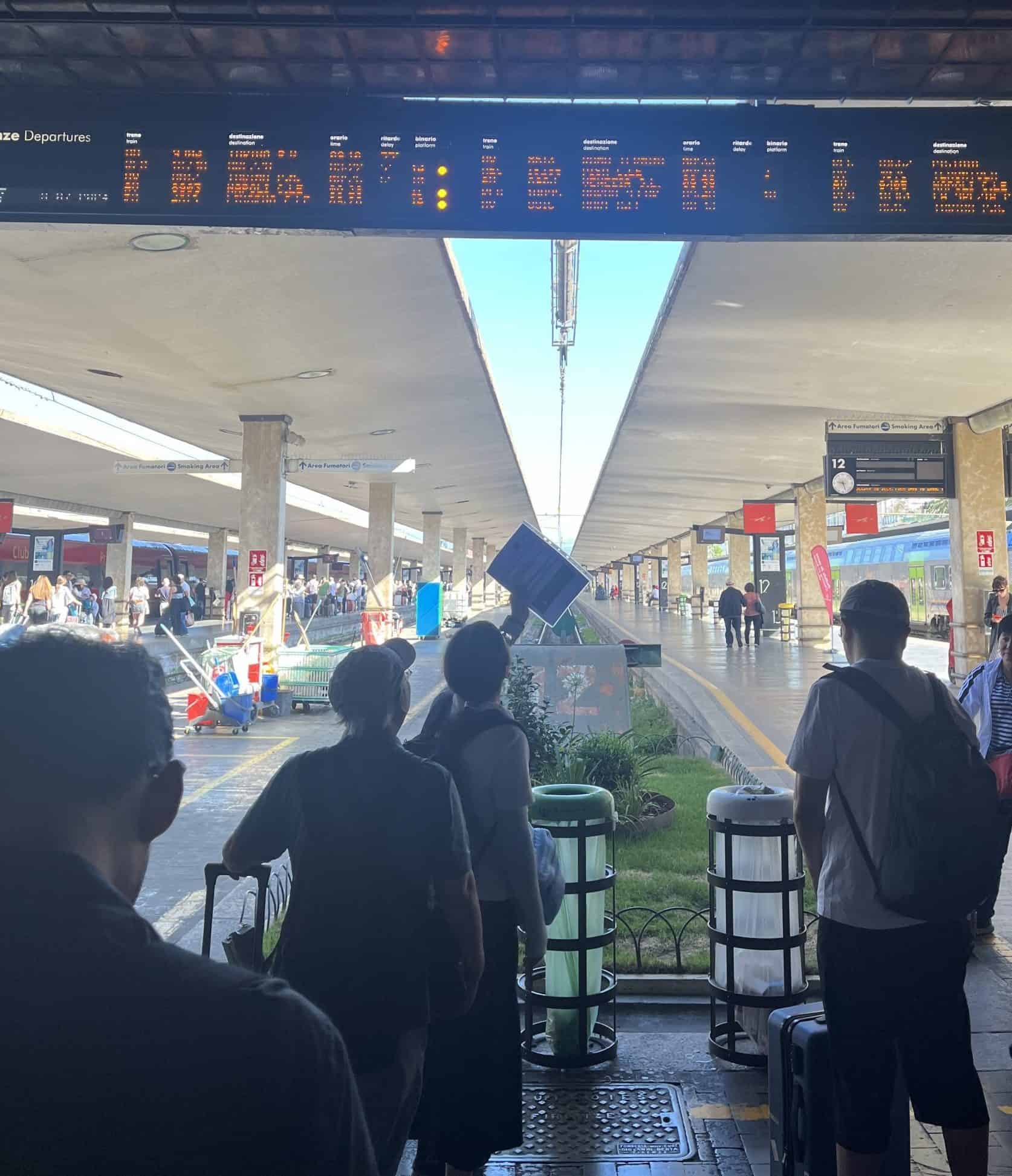 People waiting on a platform at a train station