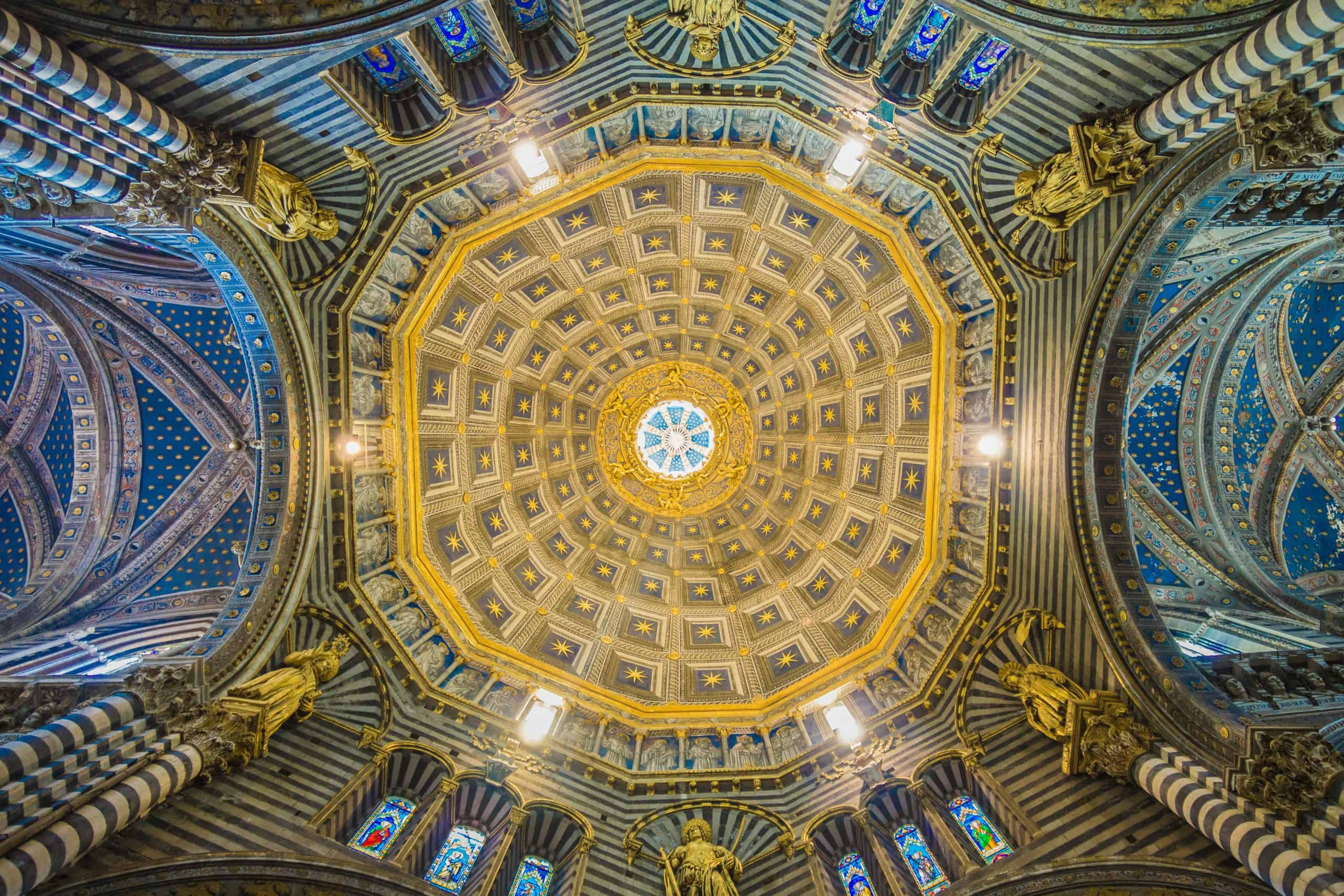 Colorful gold ceiling with statues in a church