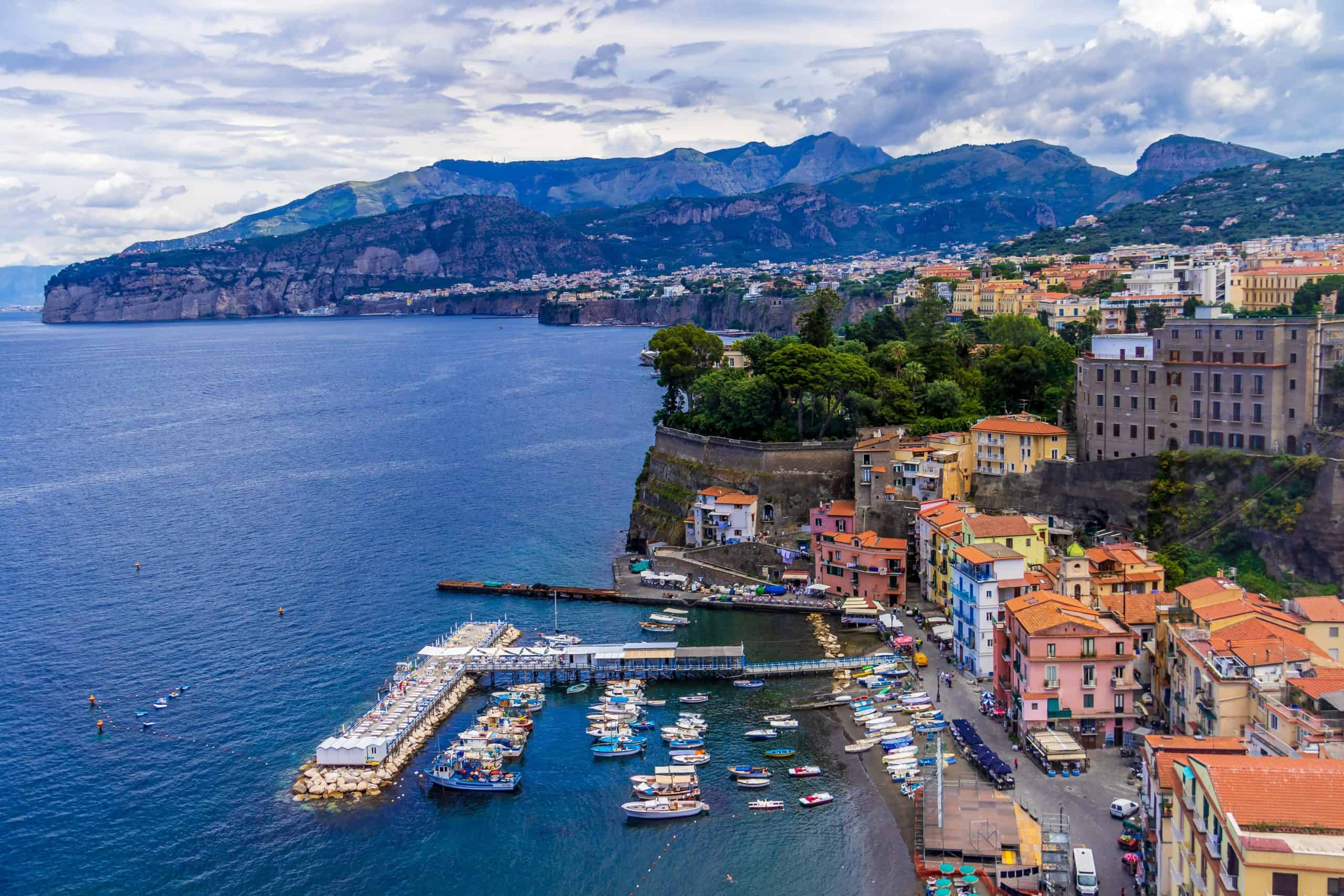Sorrento's Maria Grande with boats in the water and buildings on the cliffside