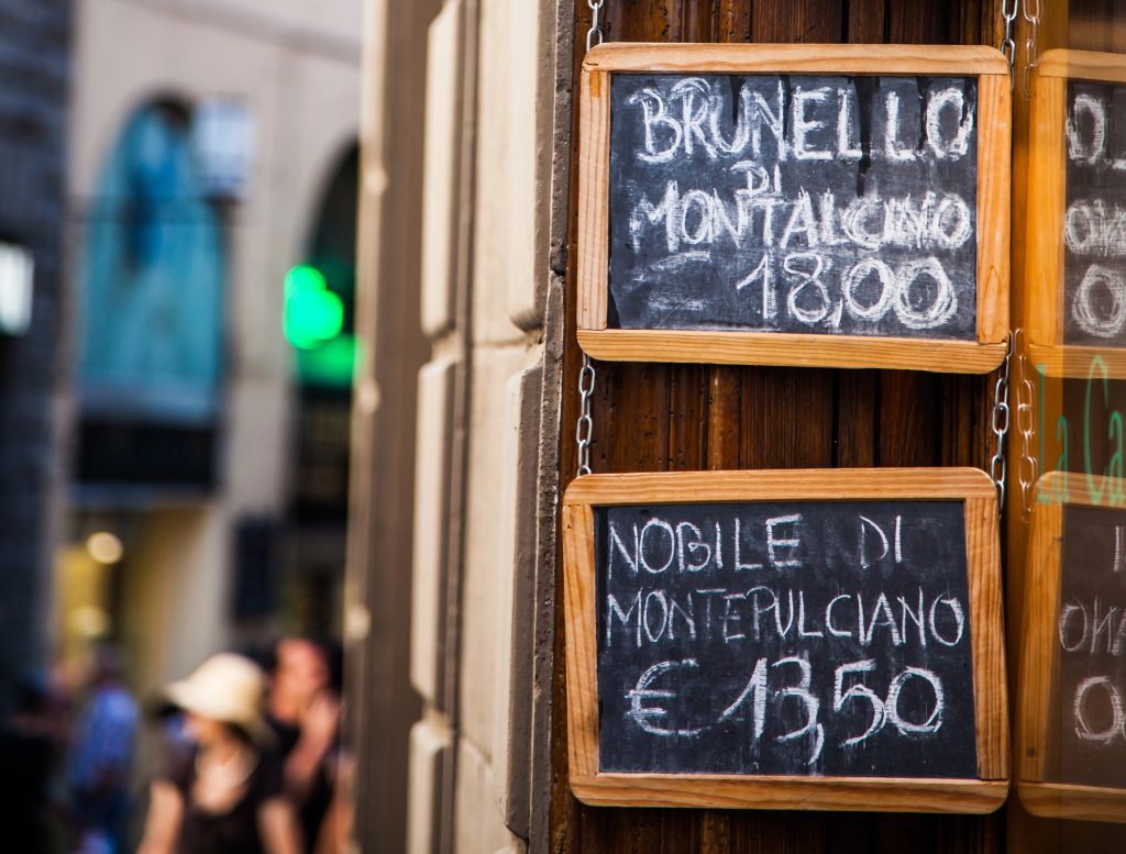 Signs that advertise Brunello and Nobile wine in Italy