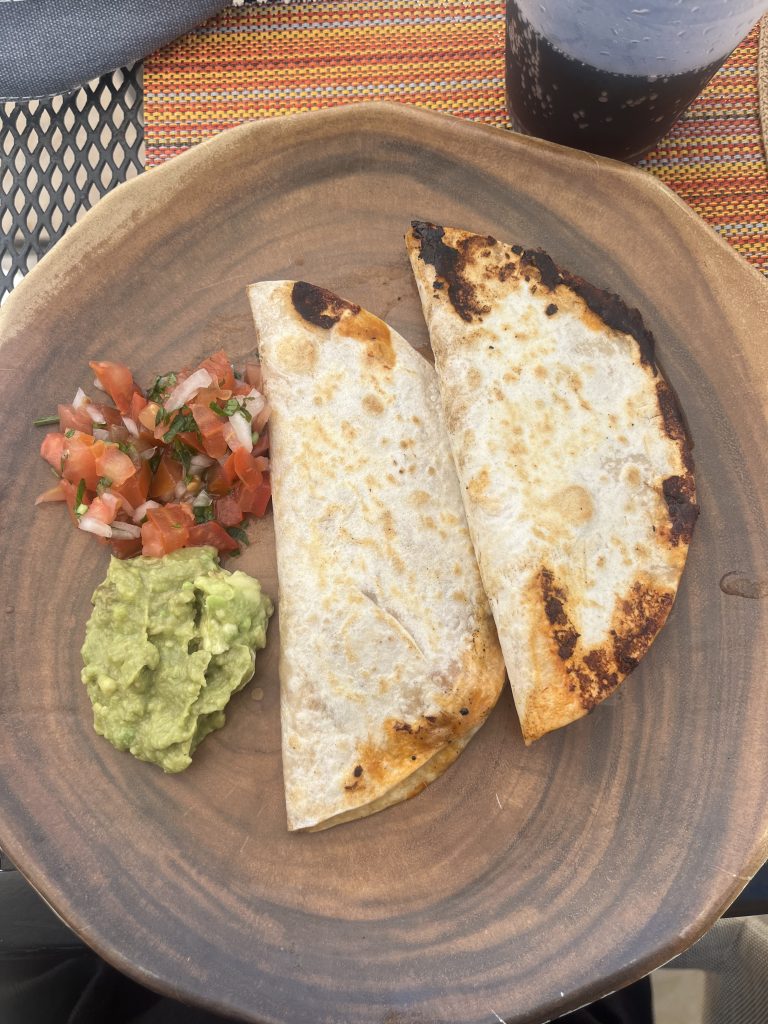 Tacos, guacamole and tomato salad