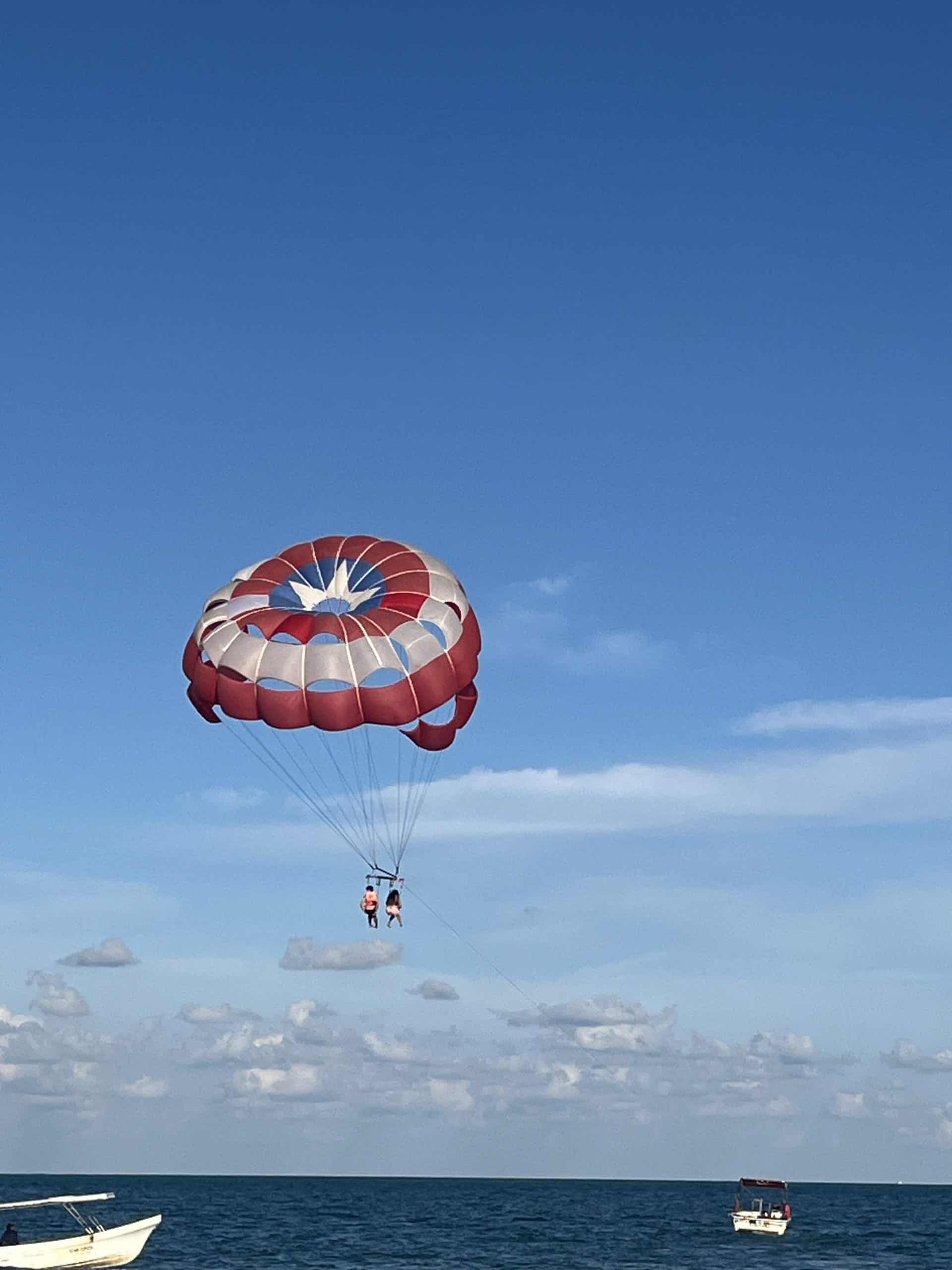 Couple parasailing at the beach 