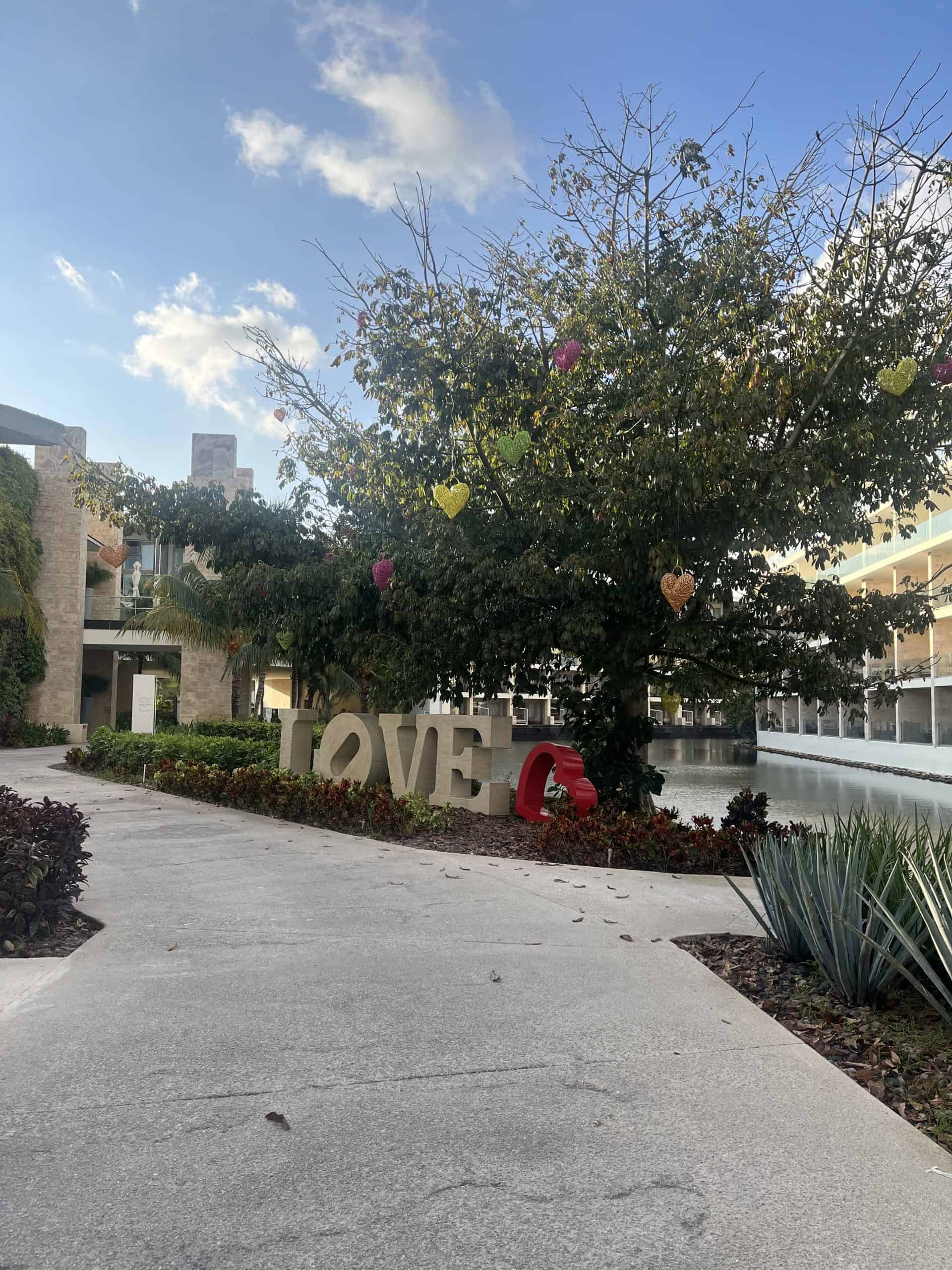 Large LOVE letters under a tree at a hotel resort