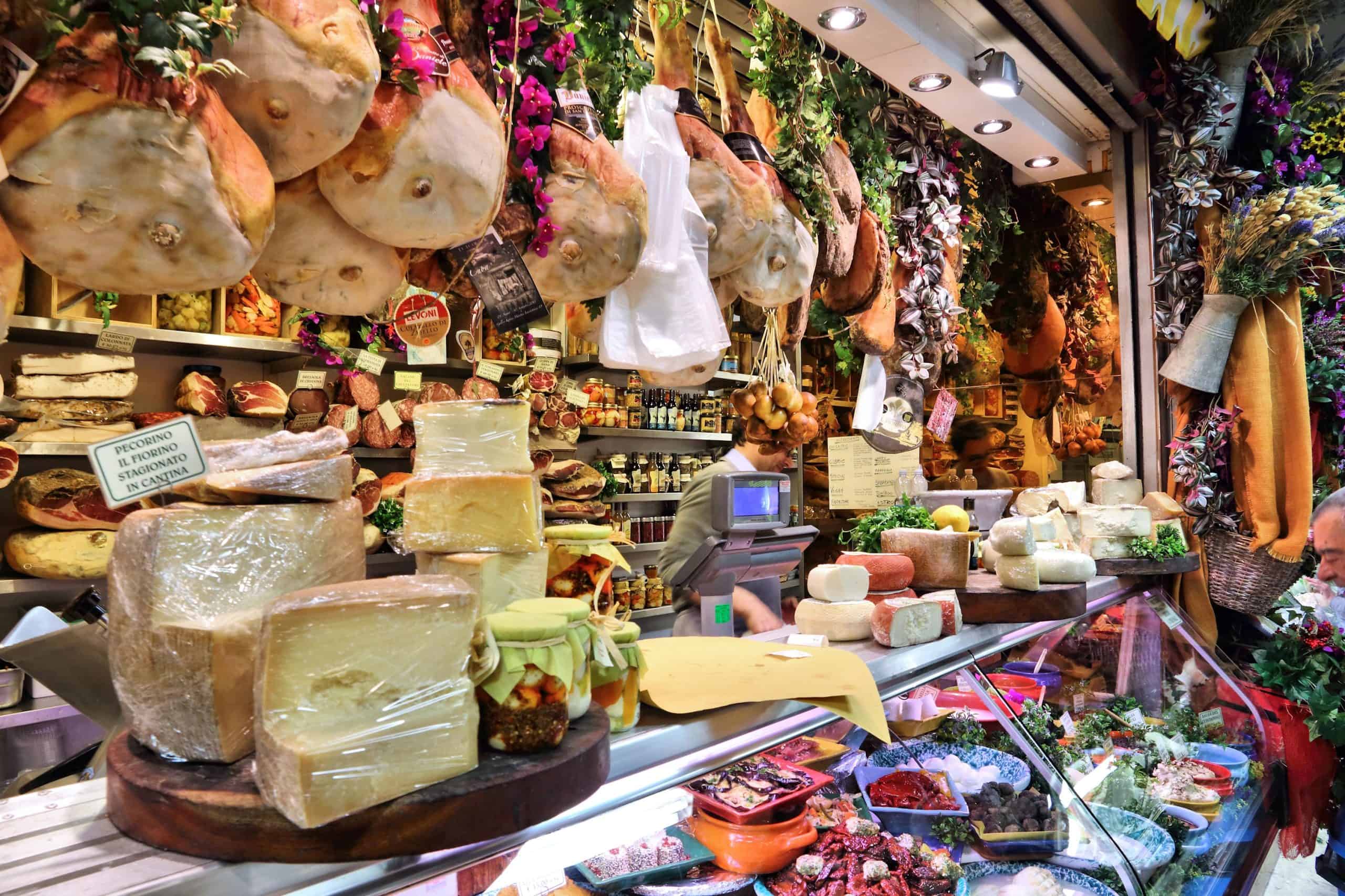 Butcher and cheese stall in food market
