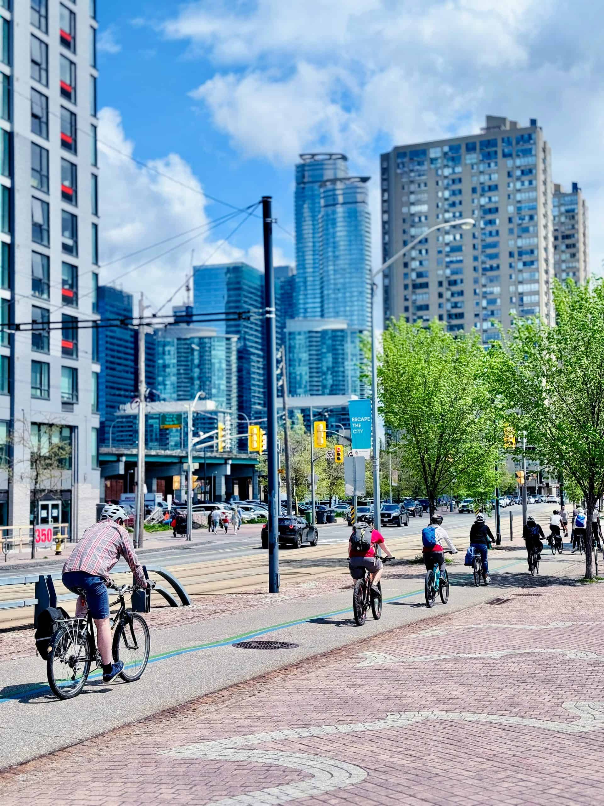 People riding bikes in downtown Toronto