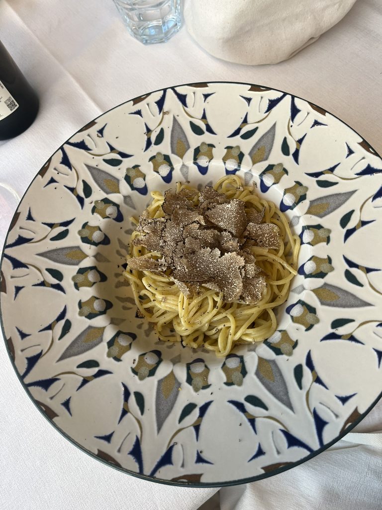 Plate of spaghetti with truffles on top