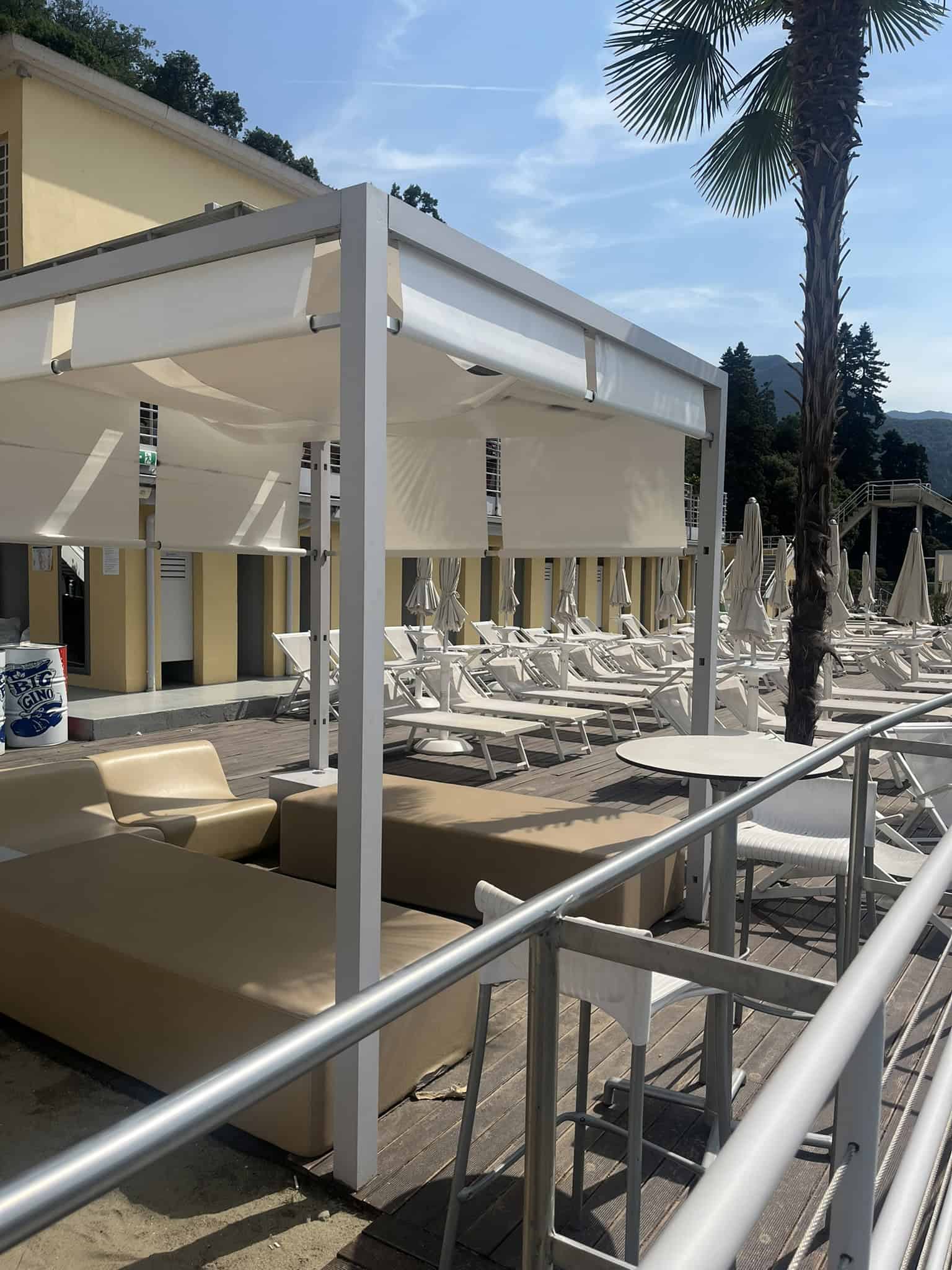 beach chairs and umbrellas at a beach club
