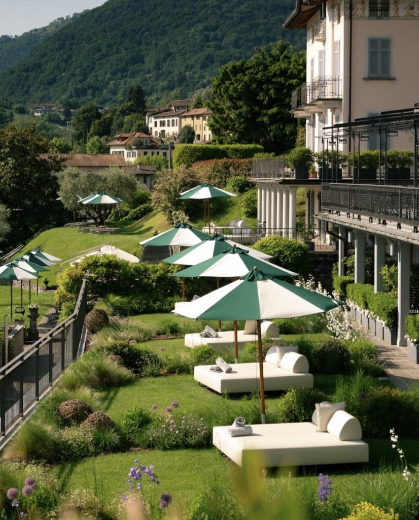 Outdoor day beds and umbrellas in a hotel garden